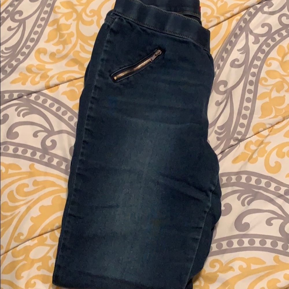 Dark wash jeggings.
